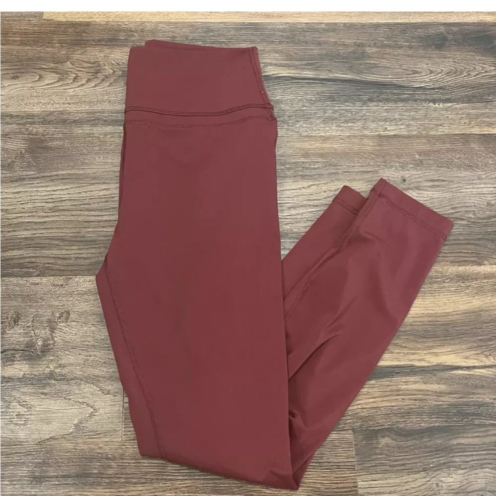 Rust High-Rise Leggings with Stretchy Fabric. Pocket on the inside left leg.Up h